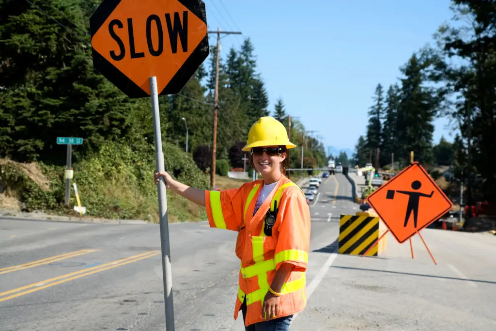 Road construction zone with workers and equipment